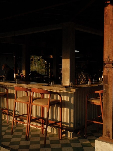 The bar at Codium, a beach club in Kuta Lombok, with the terrace open to the sea behind it